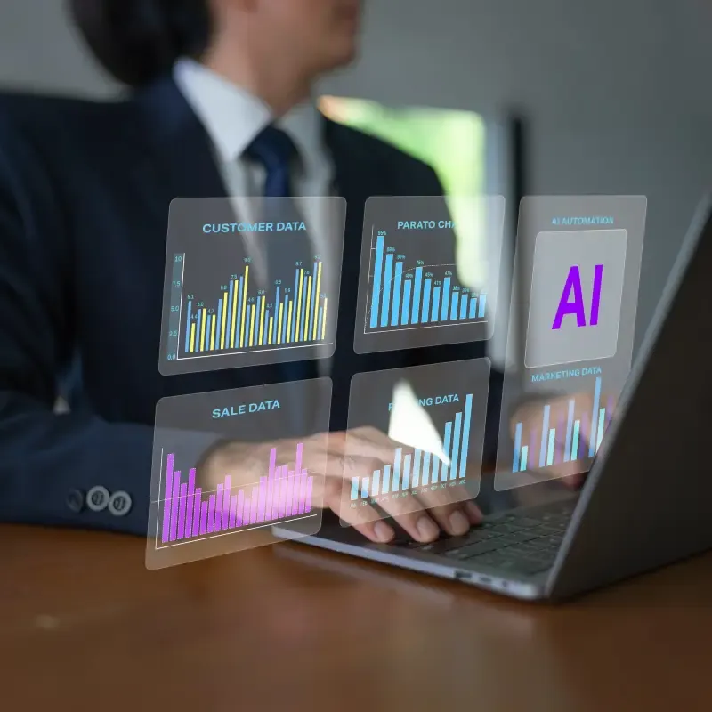 Professional at a laptop with floating holographic dashboards for customer data, sales, marketing, Pareto analysis, and AI automation.