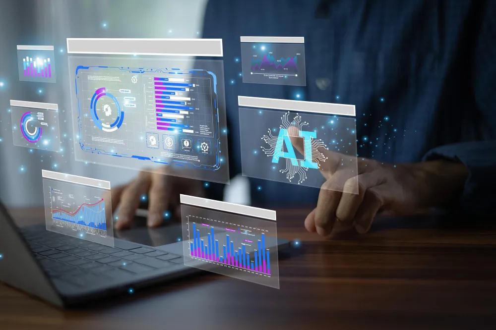 Marketer at a laptop interacting with floating holographic dashboards and AI-labelled analytics panels.