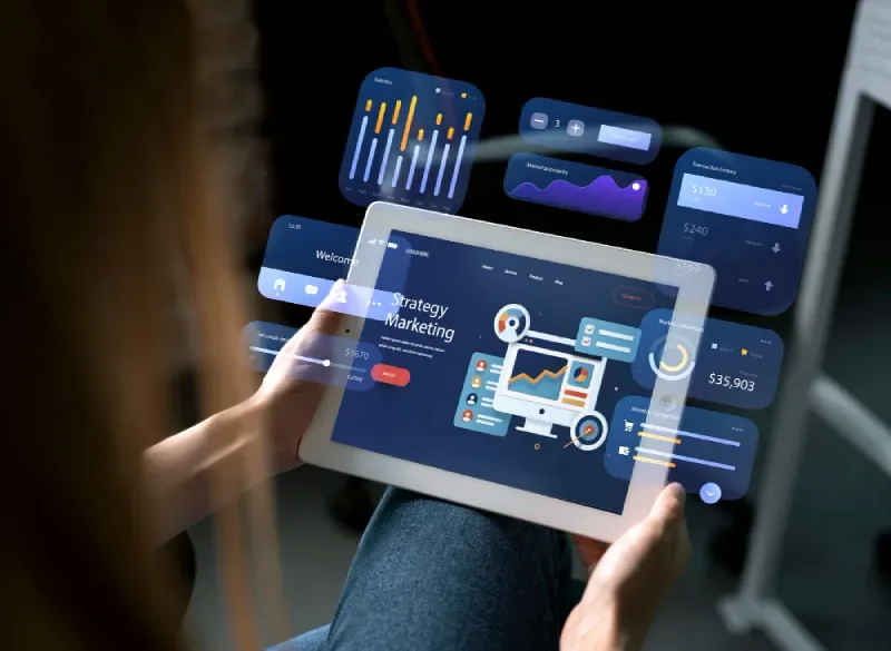 Digital marketing strategy dashboard on a tablet with performance metrics and conversion widgets.