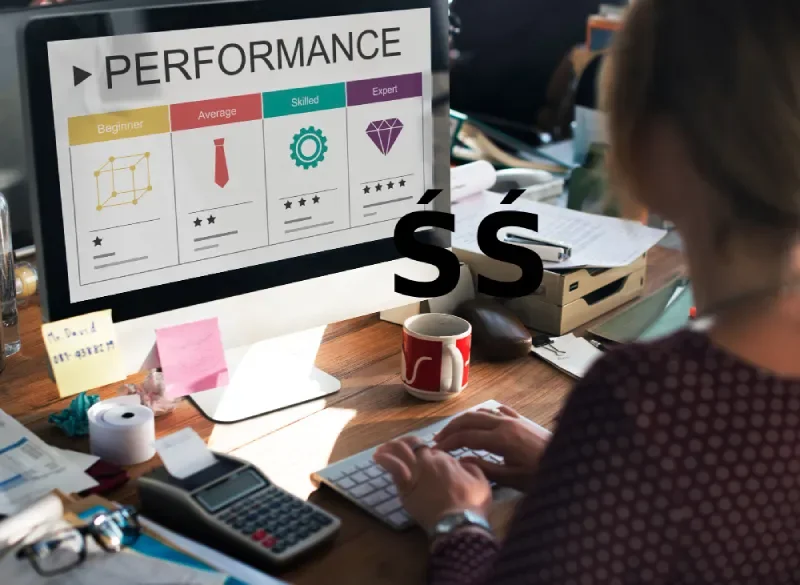 Analyst reviewing performance levels and campaign metrics on a desktop monitor.