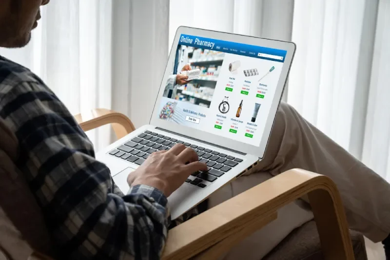 Person browsing an online shopping product catalogue on a laptop for Google Shopping Ads.