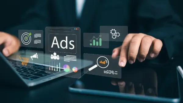 Professional managing Google Ads campaigns with analytics and targeting icons.