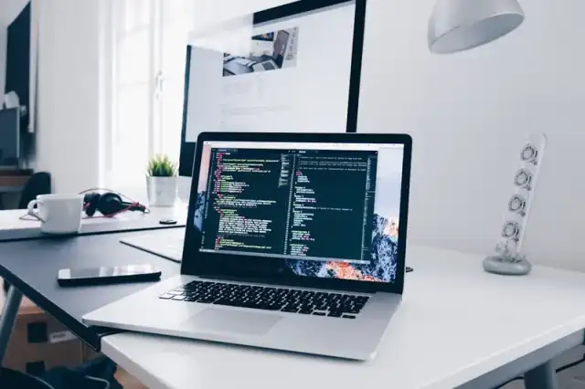 Developer building a conversion-focused website on a laptop