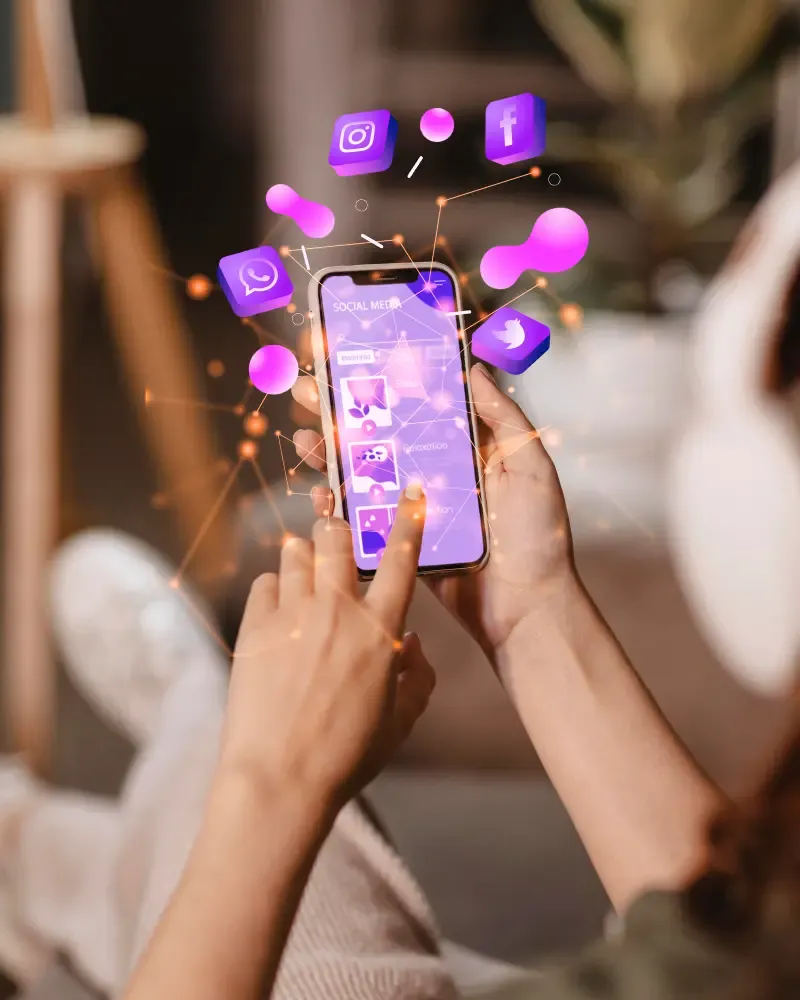 Hands using a smartphone showing Social Media on screen with floating Instagram, Facebook, WhatsApp, and Twitter cubes linked by a glowing network.